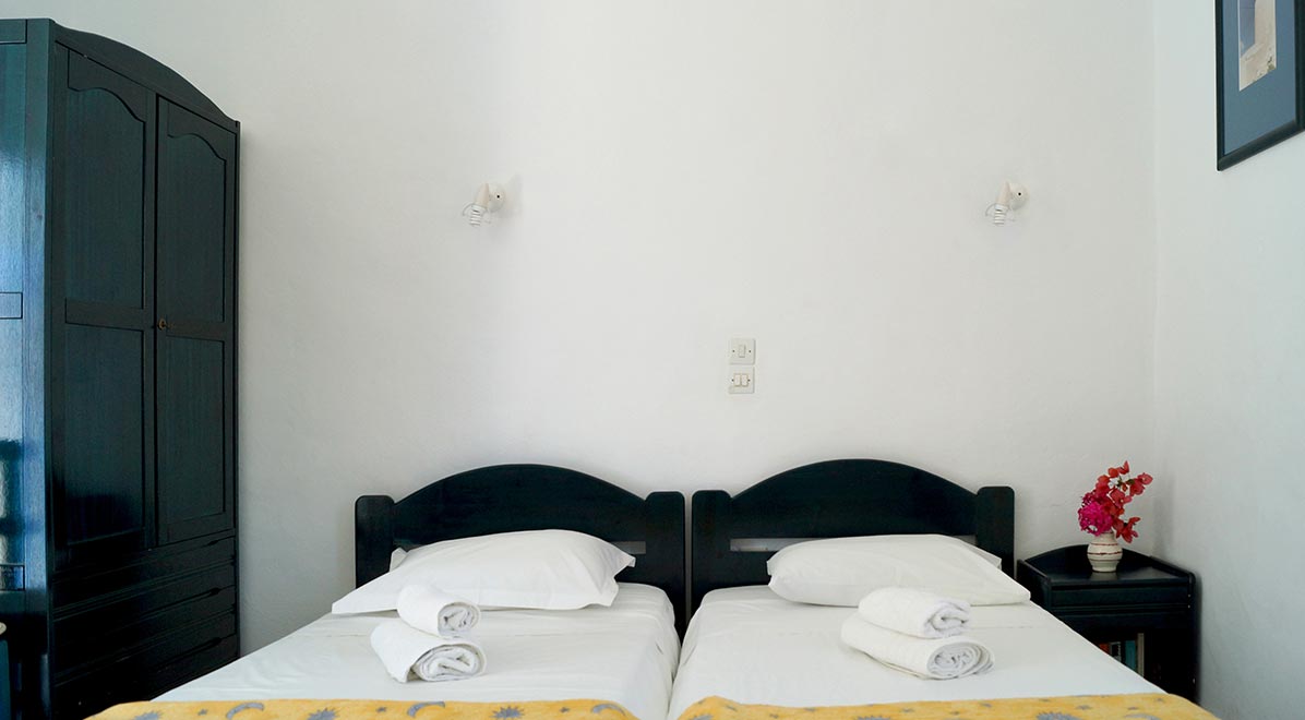 Chambre triple avec lits simples